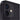 Close-up of a black smartphone's camera and flash on a white background